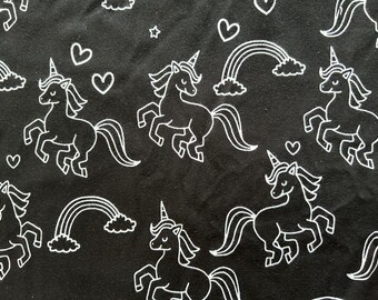 Unicorns and rainbows knit fabric by the yard for clothing. NOT quilting fabric