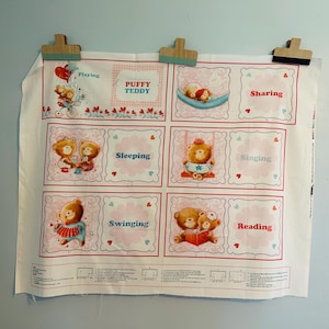 May include: A white fabric panel with a repeating pattern of teddy bears and hearts. Each panel features a different activity, including playing, sharing, sleeping, singing, swinging, and reading. The text "Puffy Teddy" is printed on the panel.