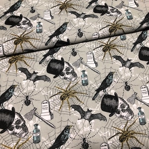 Skull with a top hat Fabric by the yard 100% Cotton Clothing Crafts Quilt GOLD spider web tomb stone  bats poison Halloween icons met