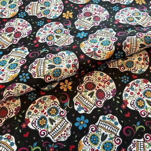 Folkloric Skulls fabric by the yard 100% Cotton for Quilting crafts flowers day of the dead skull black floral sugar skull David textiles
