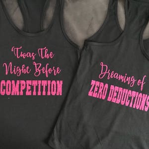 May include: Two black tank tops with pink glitter text. The first tank top says "Twas the Night Before COMPETITION". The second tank top says "Dreaming of ZERO DEDUCTIONS".