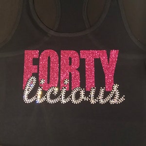 May include: Black tank top with pink glitter lettering that says "FORTY because".
