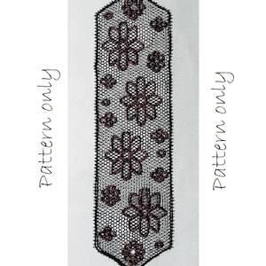 Pode incluir: Marca-páginas de contas pretas e cor-de-rosa com um padrão geométrico de flores. O marca-páginas tem aproximadamente 25 cm de comprimento.