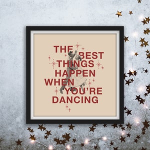 May include: A beige poster with a black frame, featuring a couple dancing with the text "THE BEST THINGS HAPPEN WHEN YOU'RE DANCING" in red.