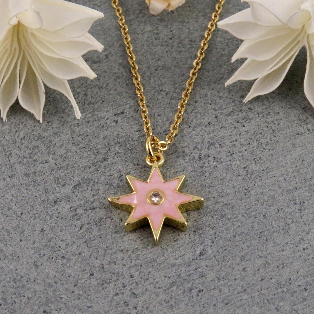 CD 26S PEARL STAR LOGO PENDANT NECKLACE IN GOLD TONE METAL