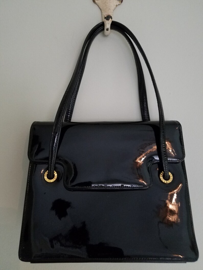 small black patent handbag