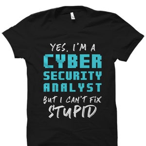 May include: Black t-shirt with a white graphic that says "Yes, I'm a Cyber Security Analyst but I can't fix stupid". The text "Cyber Security Analyst" is in blue.