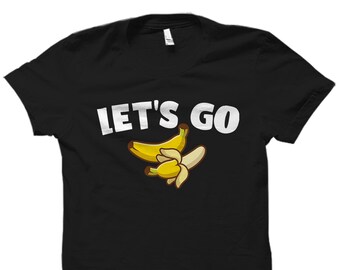 May include: Black t-shirt with the text "LET'S GO" in white letters and a graphic of two yellow bananas.