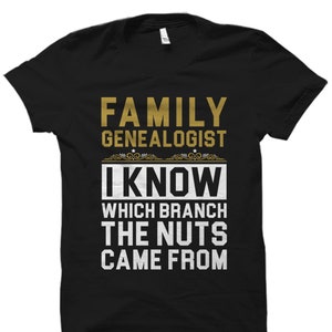 May include: Black t-shirt with gold text that reads "Family Genealogist I Know Which Branch The Nuts Came From".