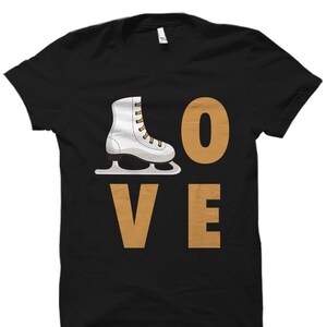 May include: Black t-shirt with a white ice skate and the word "LOVE" in gold letters.