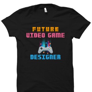 May include: Black t-shirt with the text "FUTURE VIDEO GAME DESIGNER" in a pixelated font. A pixelated image of a video game controller is below the text.
