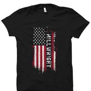 May include: Black t-shirt with a distressed American flag design and the word "MILLWRIGHT" in white text.