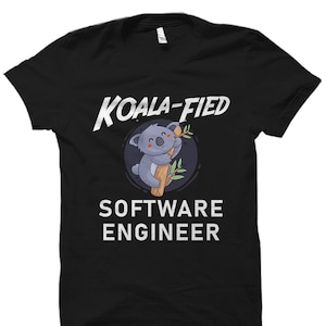 May include: Black t-shirt with a white graphic of a koala holding onto a branch. The text "Koala-fied Software Engineer" is printed in white below the koala.