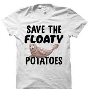 May include: White t-shirt with a cartoon seal and the text "Save the Floaty Potatoes".