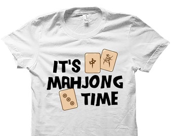 May include: White t-shirt with black text that reads "It's Mahjong Time". The text is surrounded by four mahjong tiles.