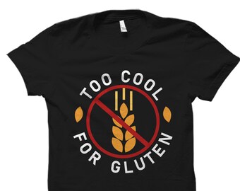 May include: Black t-shirt with a white graphic that says "Too Cool For Gluten" with a red circle and a crossed-out wheat stalk.