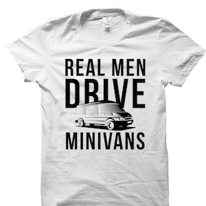 May include: White t-shirt with black text that reads "Real Men Drive Minivans". A black and white illustration of a minivan is in the center of the text.