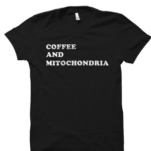May include: Black t-shirt with white text that reads "Coffee and Mitochondria".