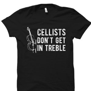 May include: Black t-shirt with a white graphic of a cello and the text "Cellists don't get in treble".