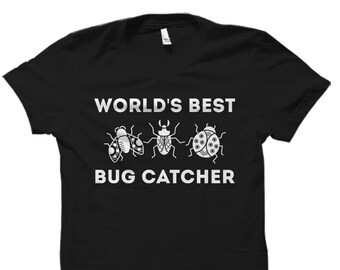 May include: Black t-shirt with white text that reads "WORLD'S BEST BUG CATCHER". Three white silhouette bugs are shown below the text.