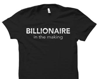 May include: Black t-shirt with white text that reads "BILLIONAIRE in the making".