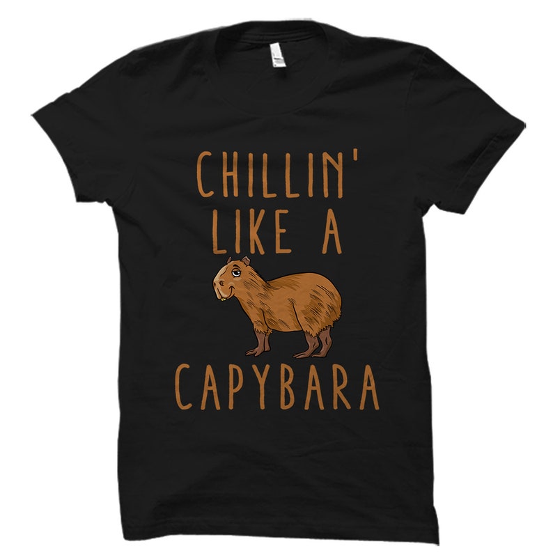 May include: Black t-shirt with a brown cartoon capybara and the text "Chillin' Like A Capybara".