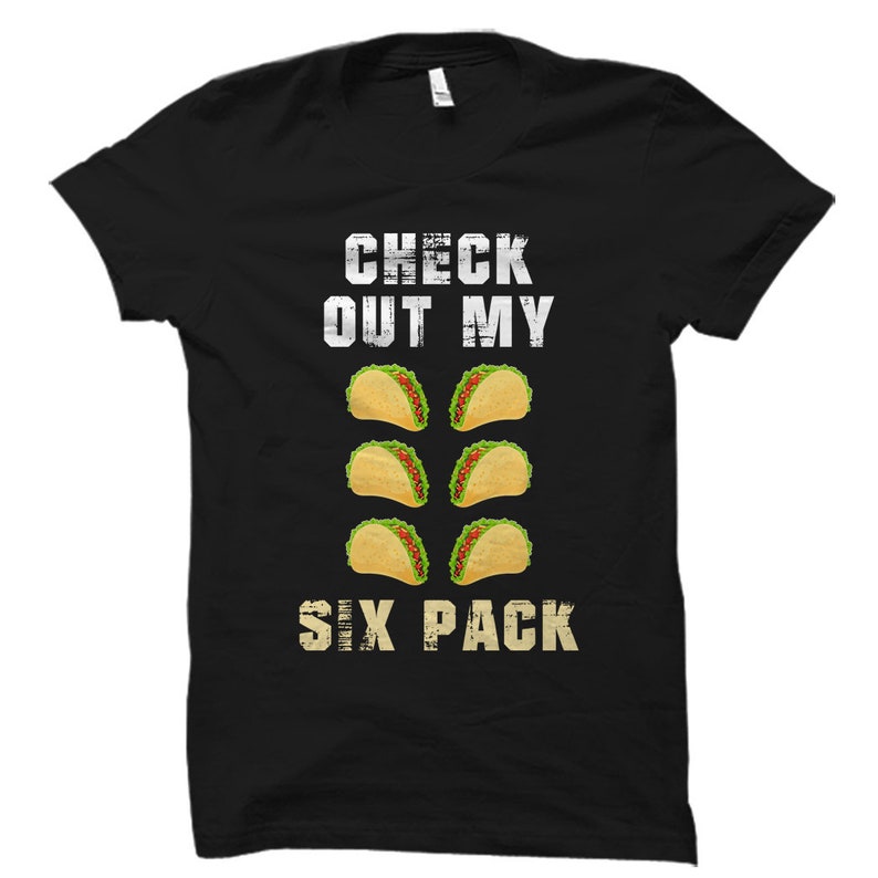 May include: Black t-shirt with white text that reads "Check out my six pack" and a graphic of six tacos.