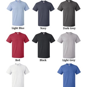May include: A selection of t-shirt colors, including light blue, navy, dark grey, red, black, light grey, white, and blue.