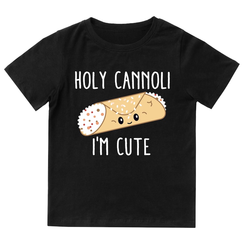 May include: Black t-shirt with a white graphic of a cannoli with a face and the text "HOLY CANNOLI I'M CUTE".