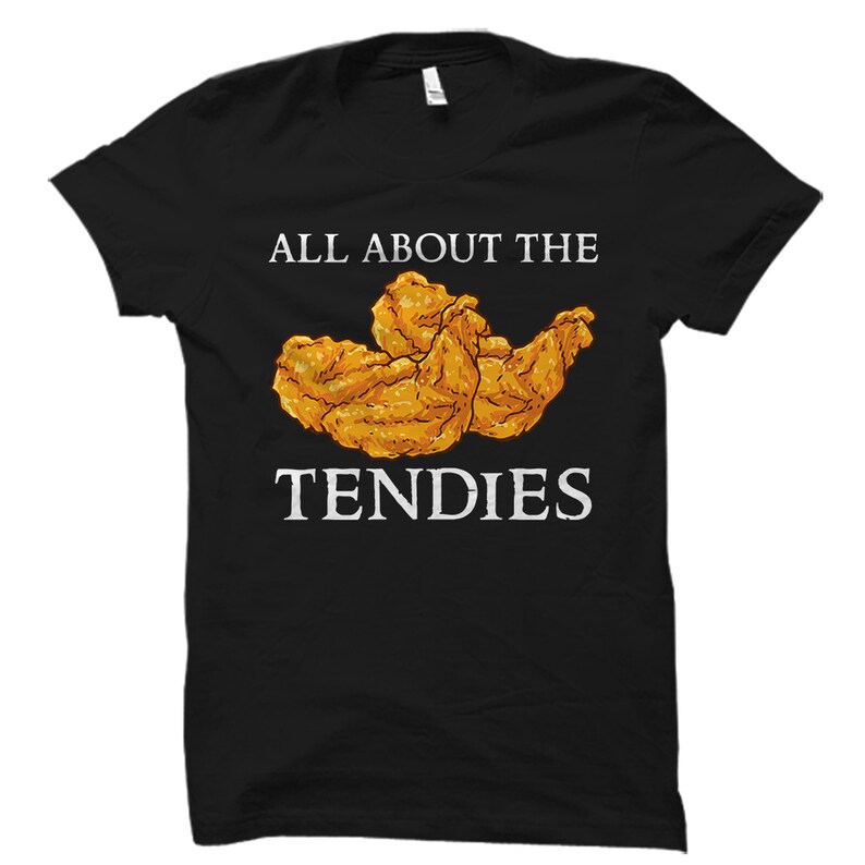 May include: Black t-shirt with white text that reads "All About The Tendies" and a cartoon image of fried chicken tenders.