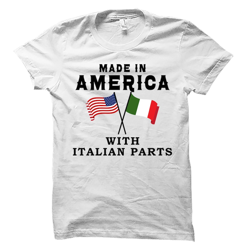 May include: White t-shirt with the text "Made in America with Italian Parts" printed on it. The shirt features a crossed American and Italian flag graphic.