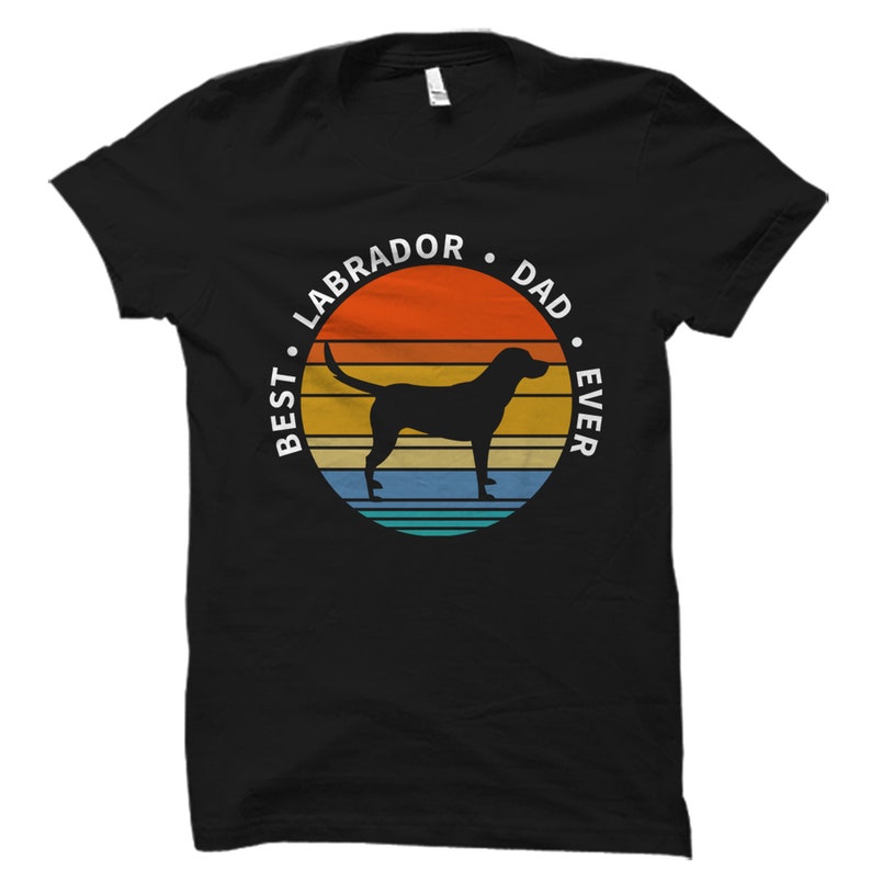 May include: Black t-shirt with a retro sunset graphic and the text "Best Labrador Dad Ever".