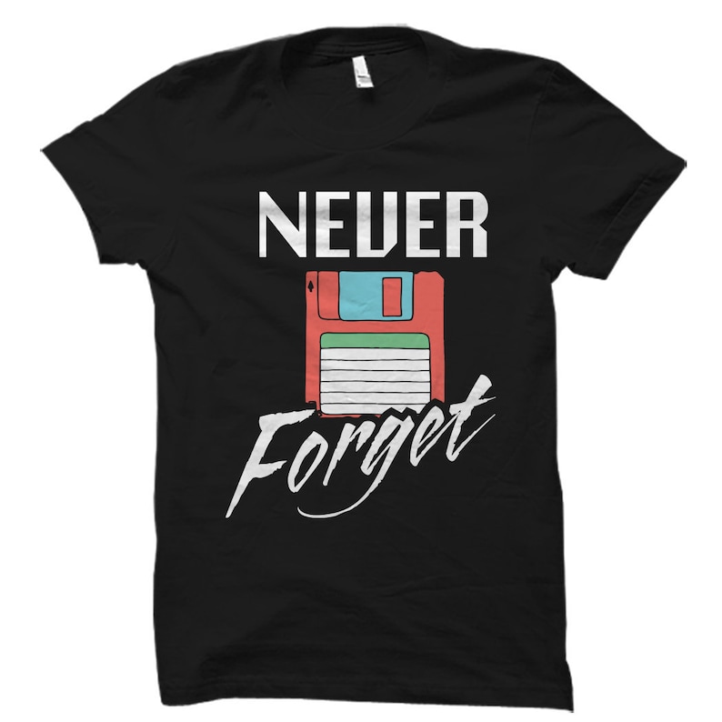 May include: Black t-shirt with white text that reads "NEVER Forget" and a retro floppy disk graphic.