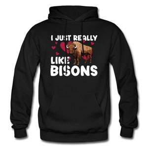 May include: Black hooded sweatshirt with the text "I just really like bisons" in white letters. A brown bison with red hearts is pictured above the text.