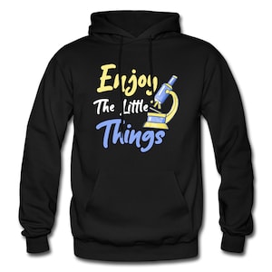 May include: Black hoodie with a yellow and blue graphic of a microscope and the text "Enjoy the little things".