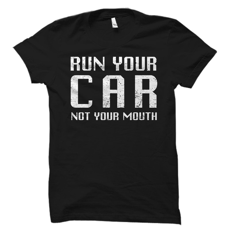 May include: Black t-shirt with white text that reads "Run Your Car Not Your Mouth".