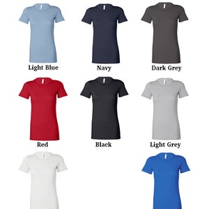 May include: A selection of t-shirt colors, including light blue, navy, dark grey, red, black, light grey, white, and blue.