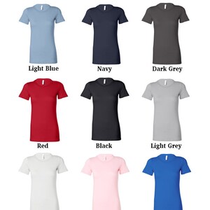 May include: Nine different color t-shirts, including light blue, navy, dark grey, red, black, light grey, white, pink, and blue.