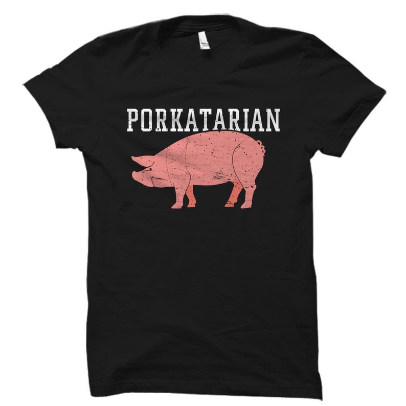 May include: Black t-shirt with the text "Porkatarian" in white lettering and a pink pig illustration.