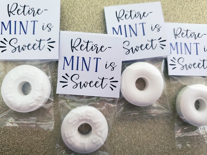 May include: Four white mint candies with a hole in the centre, packaged in clear plastic bags with white tags that read "Retire-MINT is Sweet".