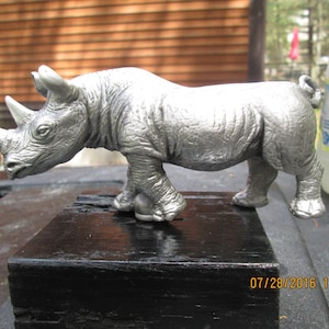 african rhinoceros hotrod, car hood ornament