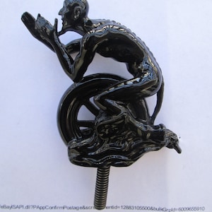 black devil on tire, rat rod, hot rod car hood ornament mascot