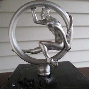 speed demon, devil, satan on rolling tire, car hood ornament