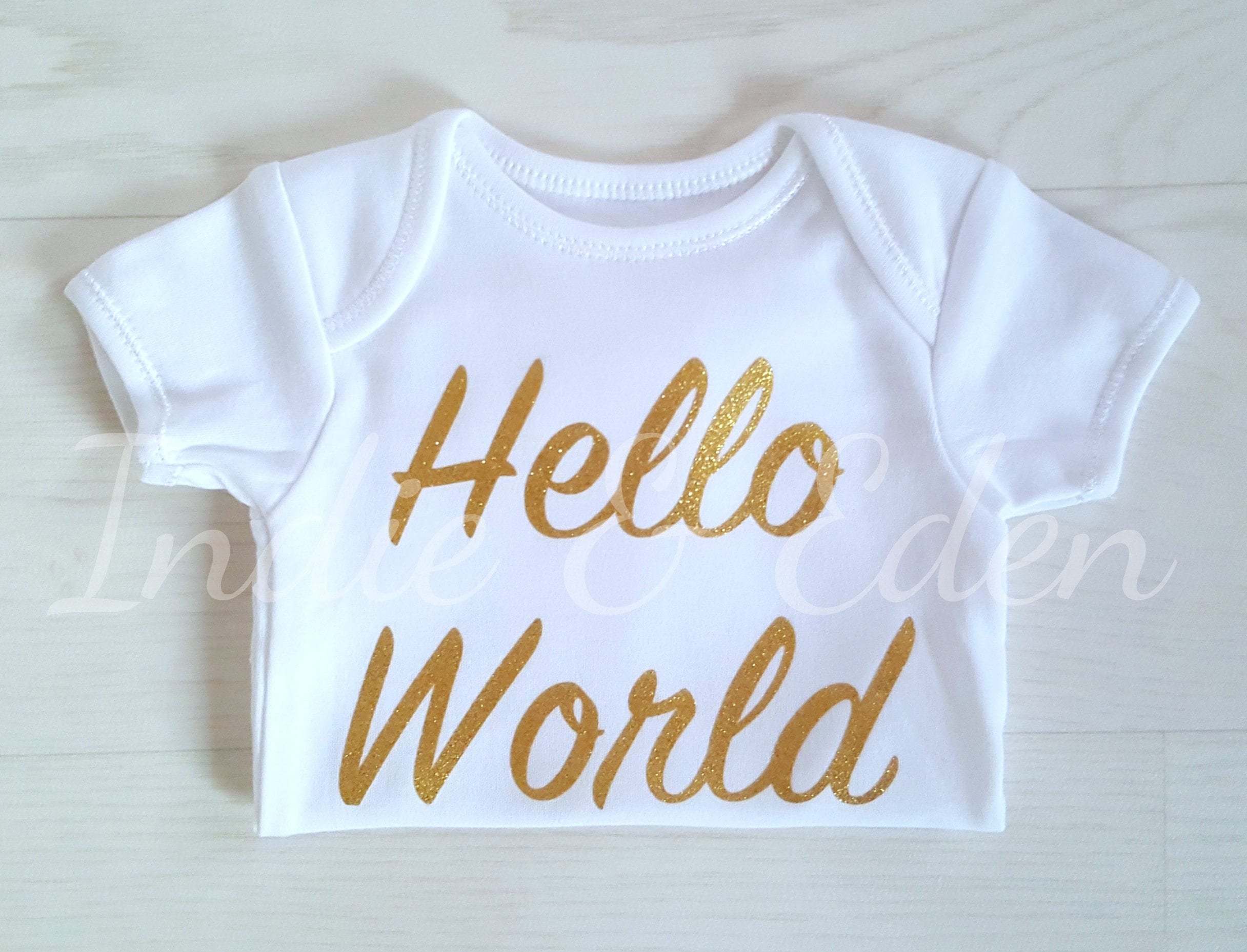 gold baby grow