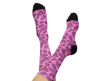 Calcetines rosas con fósiles de dinosaurio