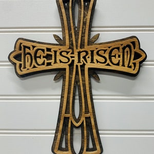 He is Risen Cross - Celebrate the message of Easter year round with this cross wall hanging. Order as a gift or keep it for yourself.