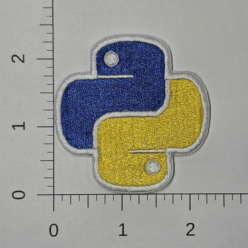 May include: A white, blue, and yellow embroidered iron-on patch featuring the Python programming language logo.