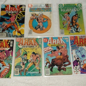 May include: A collection of eight comic books featuring the character Arak, Son of Thunder. The covers feature colorful illustrations of the character in various action poses.