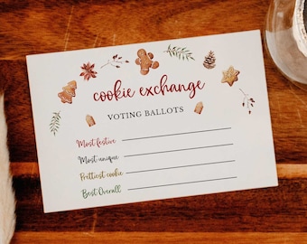May include: A white card with the text "Cookie Exchange Voting Ballots" in red and brown, decorated with gingerbread men and other festive illustrations. The card is on a wooden tray with a candle in a glass holder.