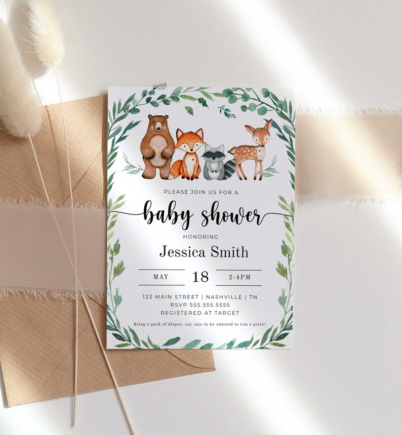 May include: A baby shower invitation with a watercolor illustration of woodland animals, including a bear, fox, raccoon, and deer. The invitation is decorated with green leaves and has the text "Please join us for a baby shower honoring Jessica Smith" and details for the event.